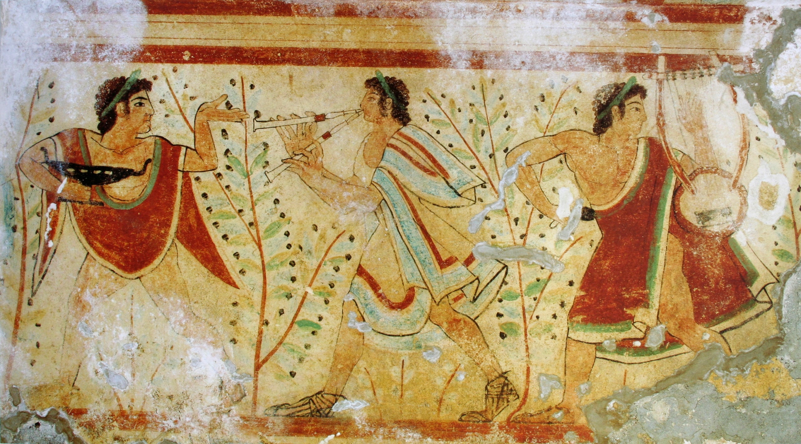 Detall fresc, ballarí dansant amb copa de vi i músics en un banquet etrusc, segle V aC.
Tomba dels Lleopards, necròpolis de Monterozzi, Tarquinia, Itàlia | Font: Wikipedia